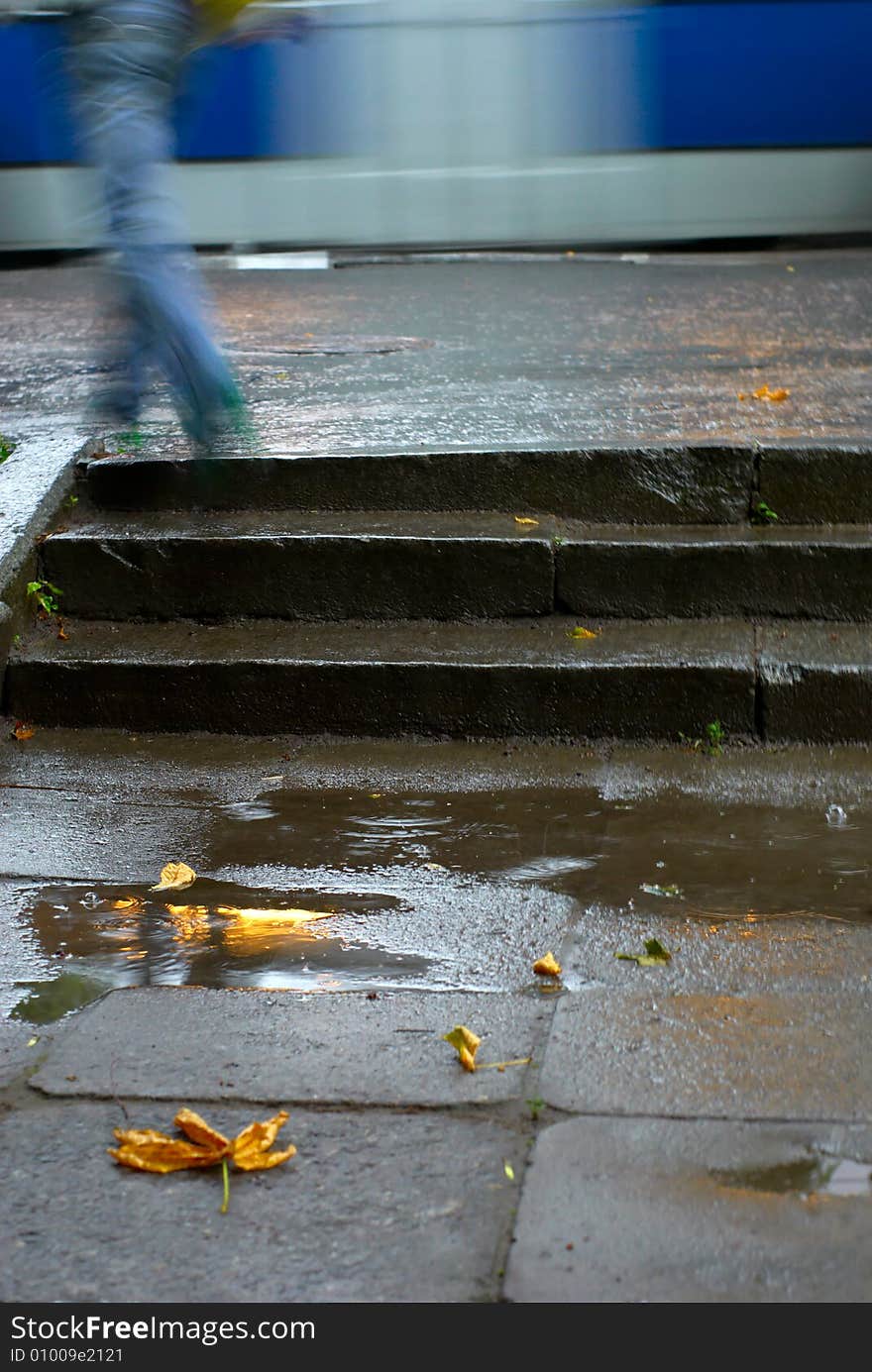 Man mounton a stair during a rain. Man mounton a stair during a rain