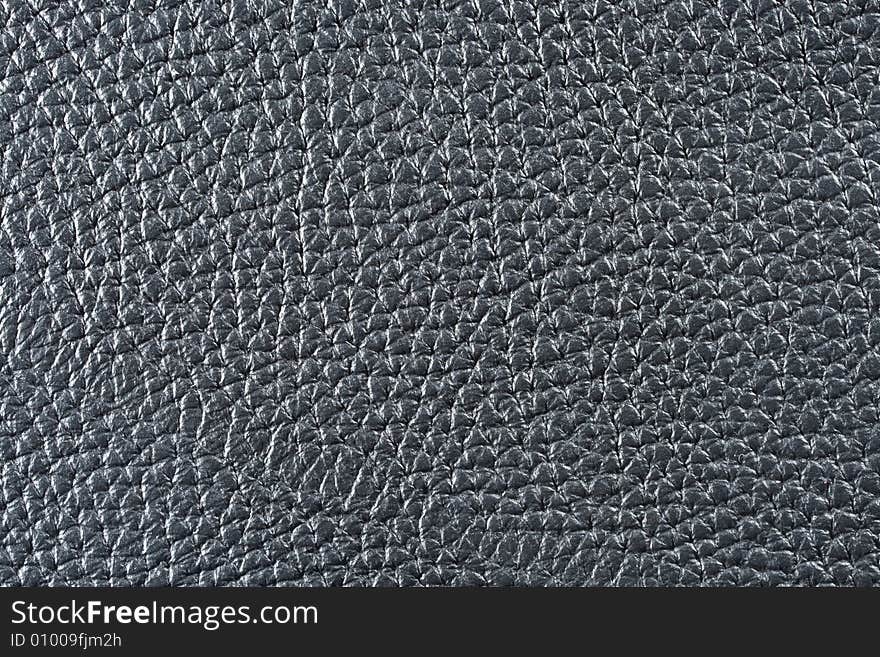 Natural qualitative black leather texture. Close up. Natural qualitative black leather texture. Close up.