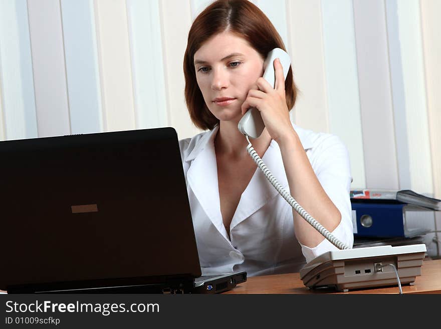 Beautiful young woman working at the office. Beautiful young woman working at the office