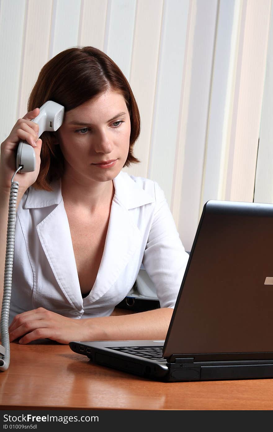 Beautiful young woman working at the office. Beautiful young woman working at the office