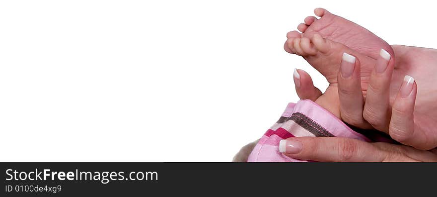 Baby feet held by mothers hand in front of white background