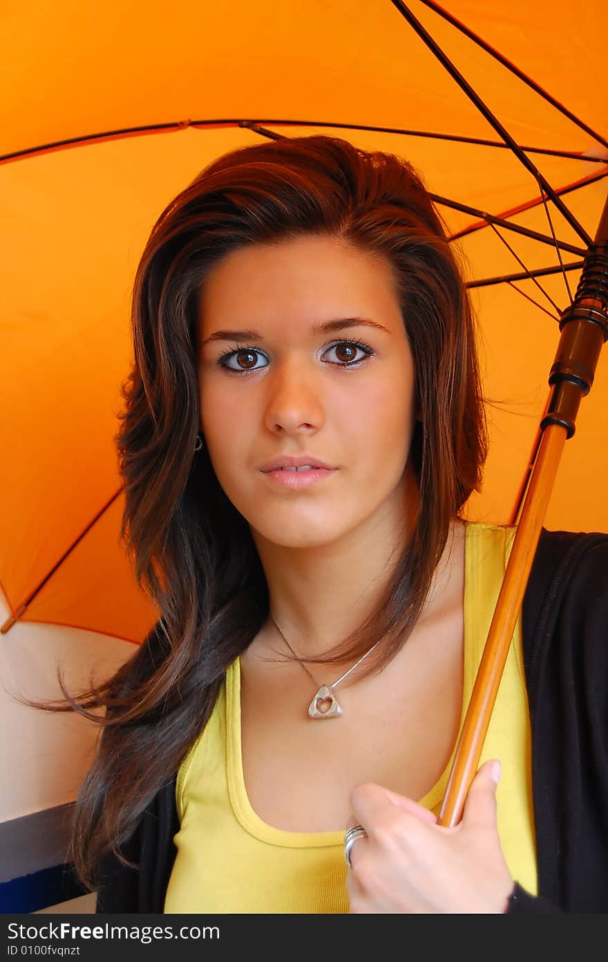 Portrait of a cute young girl with umbrella