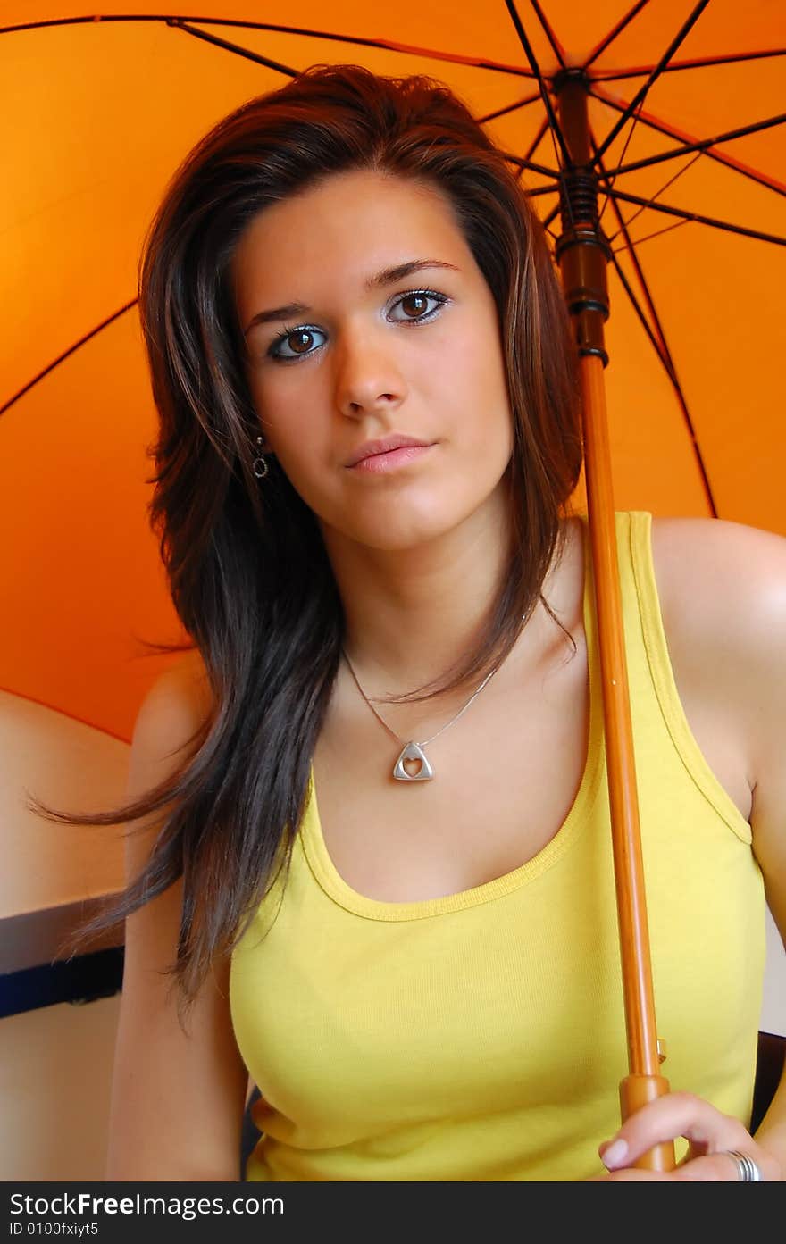 Portrait of a cute young girl with umbrella