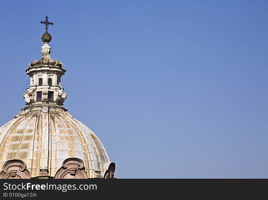 A dome of roman Church in a blue sky. A dome of roman Church in a blue sky