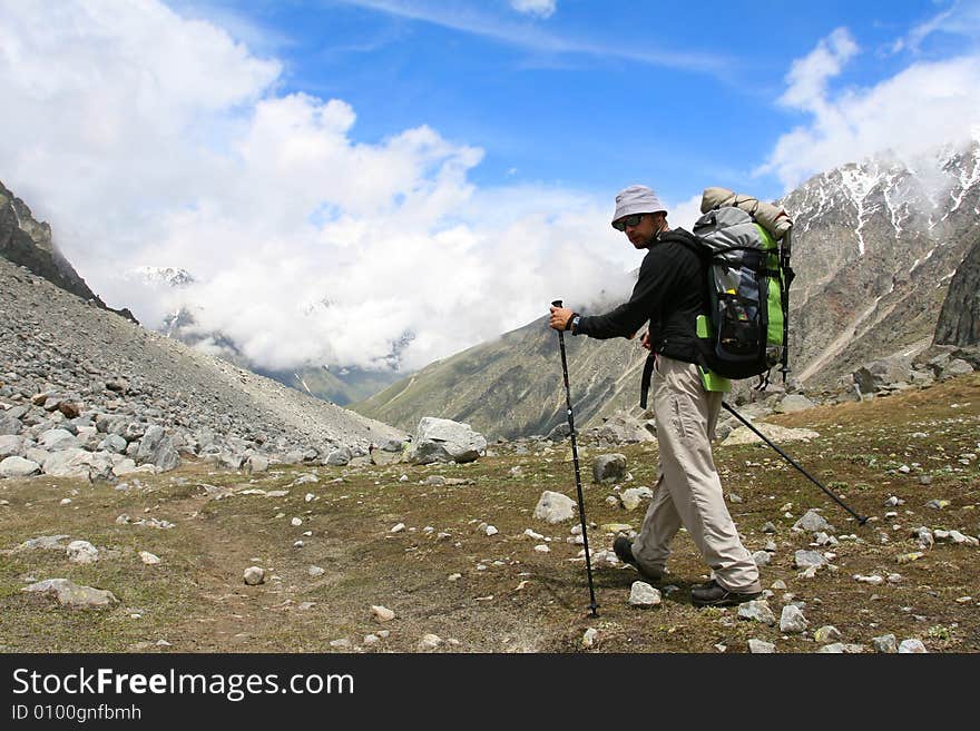 Hikers on the cliff in mountain. Hikers on the cliff in mountain