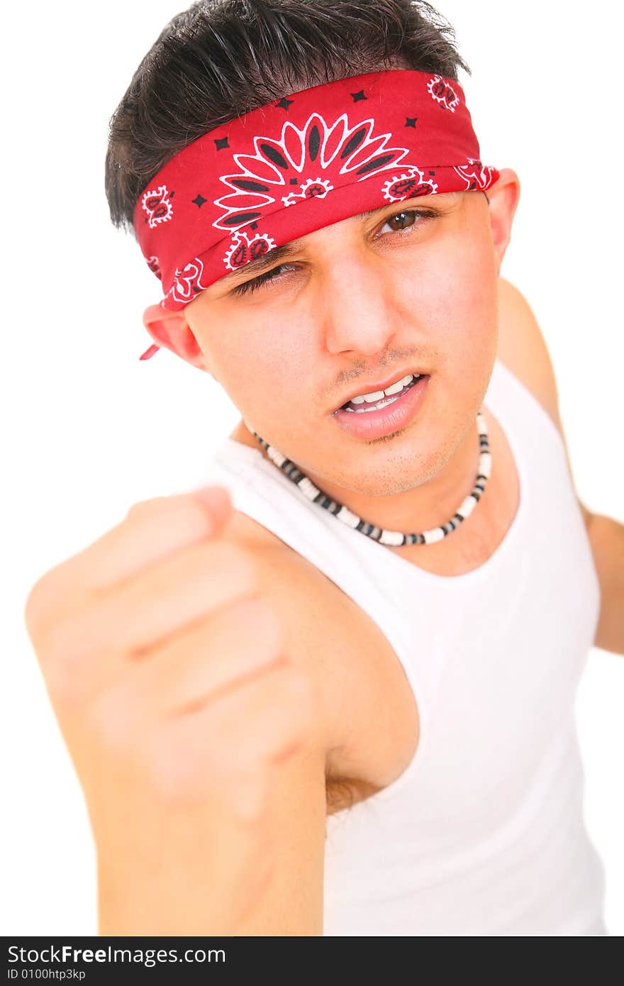 Young rocker/punk showing his fist and angry expression. isolated on white background. Young rocker/punk showing his fist and angry expression. isolated on white background