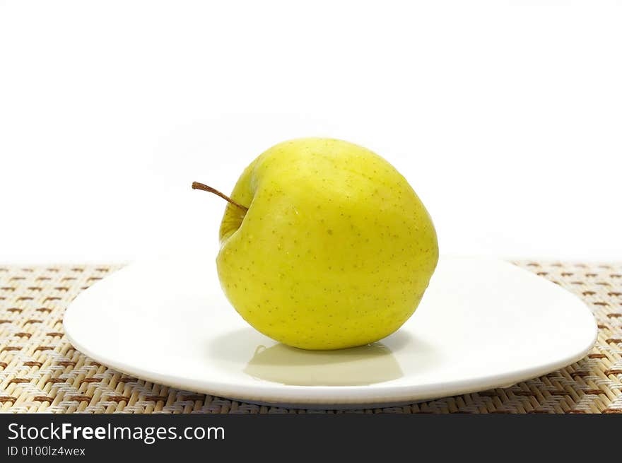 Yellow Apple On A Plate