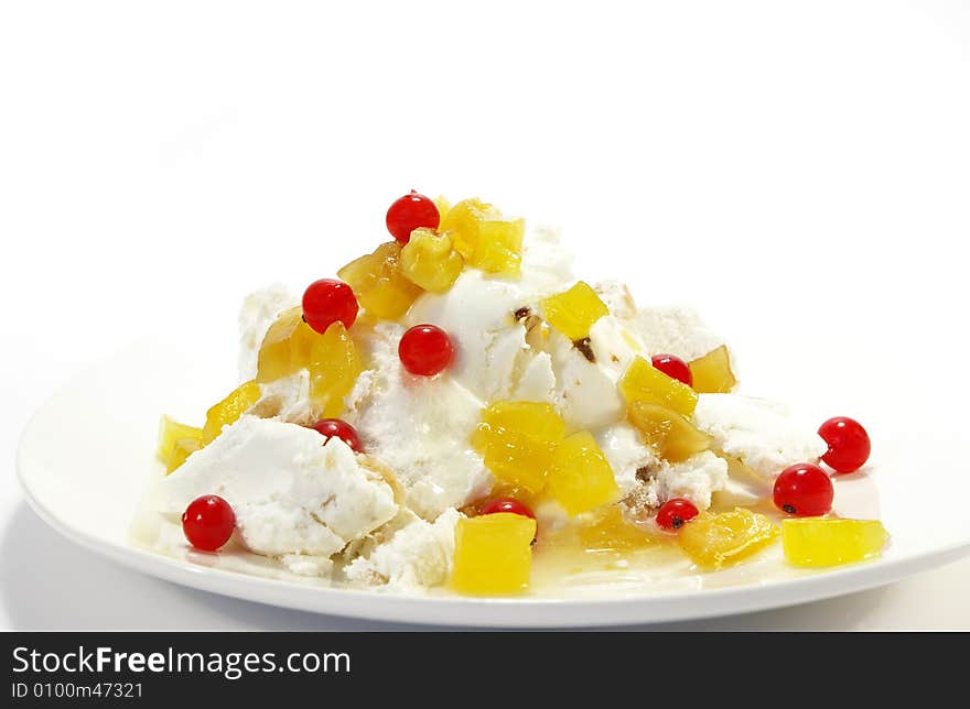 Vanilla ice-cream with pineapples and red currant