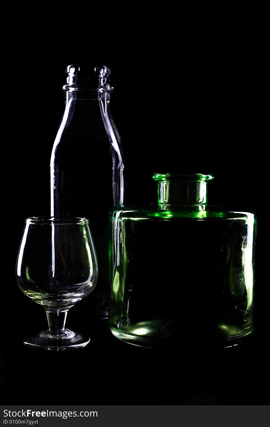 An image of bottles on black background. An image of bottles on black background