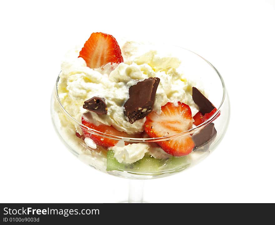 Ice cream topped with syrup, nuts, whipped cream and strawberrie. Image isolated on white. Ice cream topped with syrup, nuts, whipped cream and strawberrie. Image isolated on white.