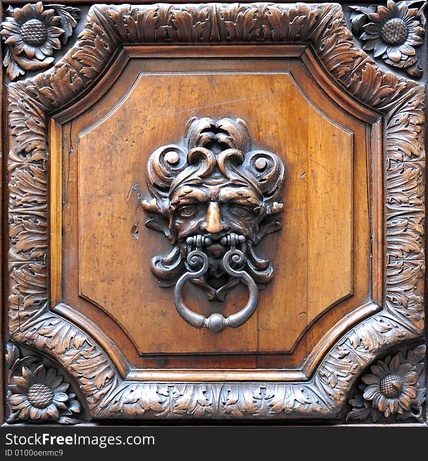 Old door knocker with grotesgue ornament