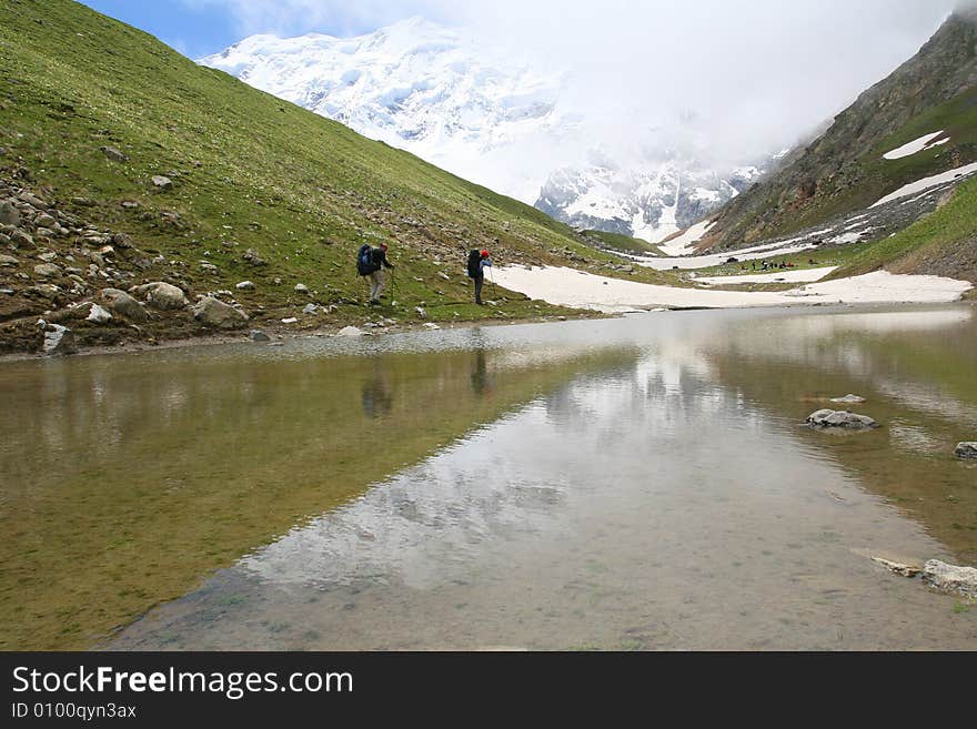 Hikers on the cliff in mountain,. Hikers on the cliff in mountain,