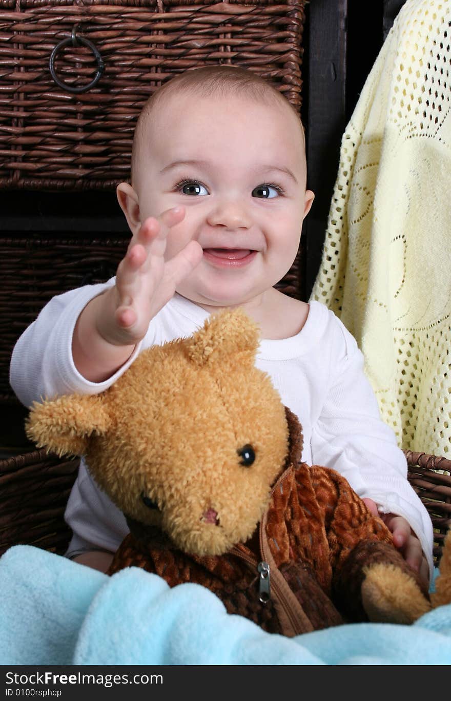 Six month old baby sitting infront of wooden drawers. Six month old baby sitting infront of wooden drawers