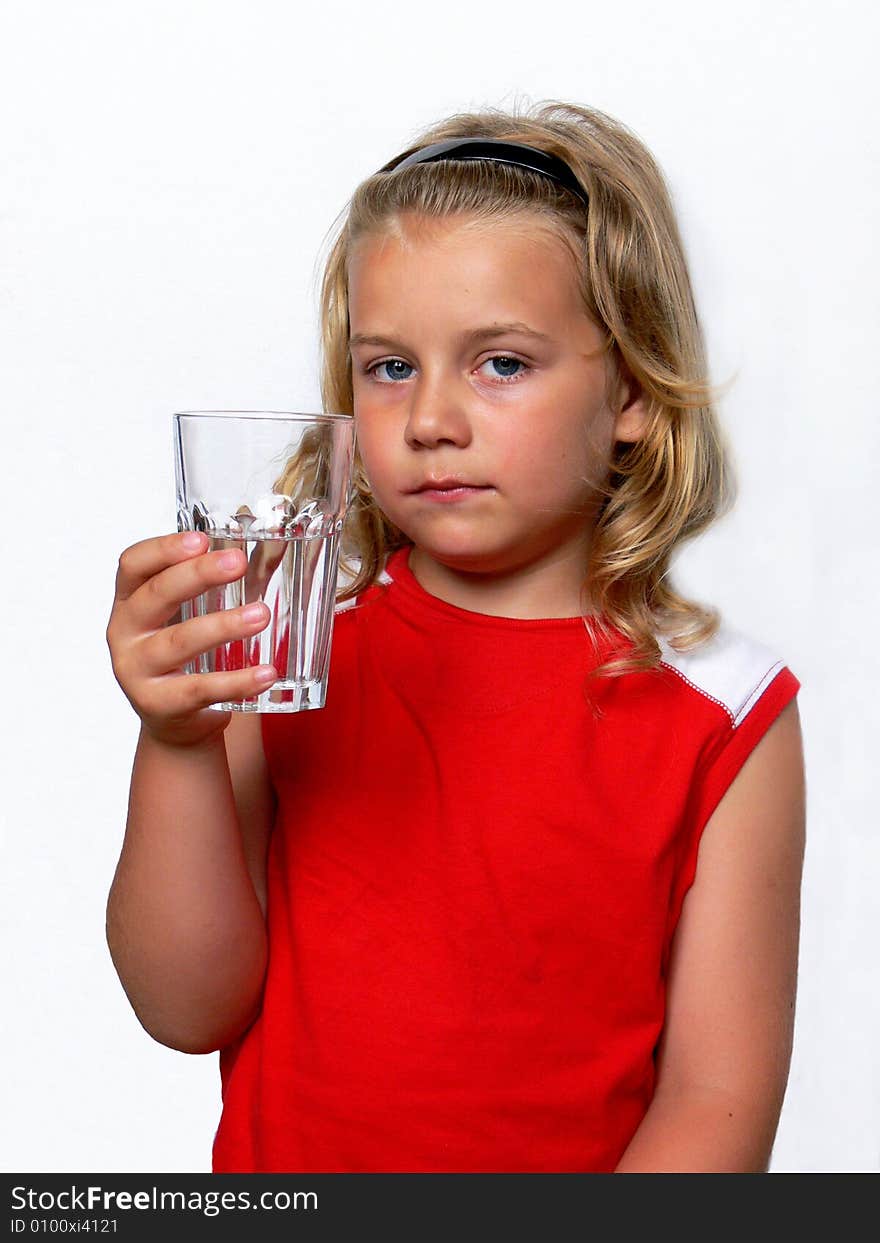 Boy showing a glass of water on a white background. Boy showing a glass of water on a white background.