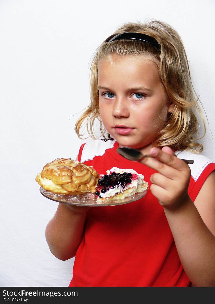 The blond boy is eating the sweets. The blond boy is eating the sweets.