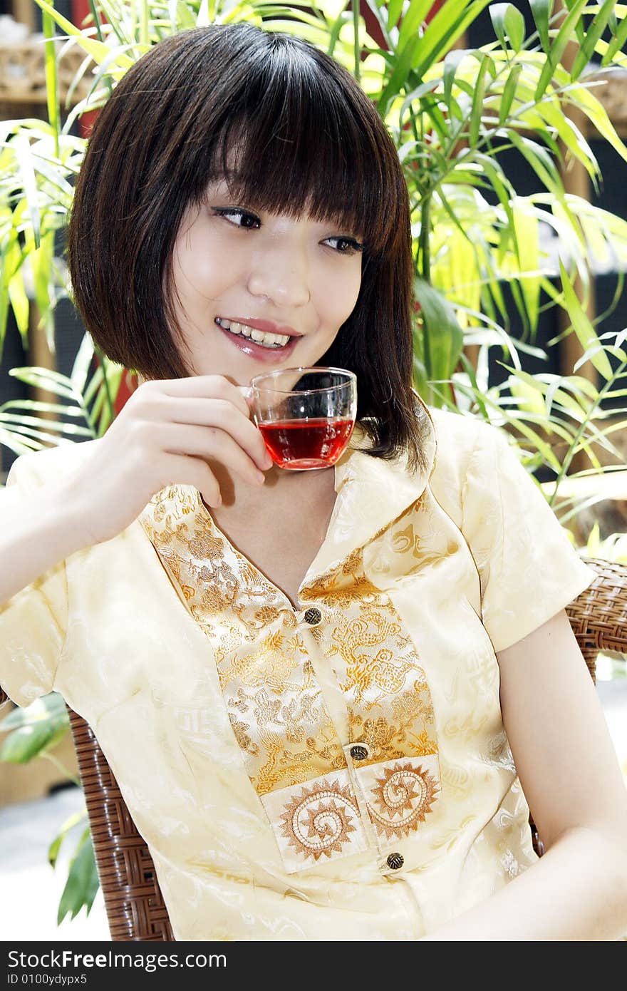 A Chinese girl tasting tea in the ancient teahouse.

This is a tea with Hawthorn and the modulation of fruit tea. A very good health to help.