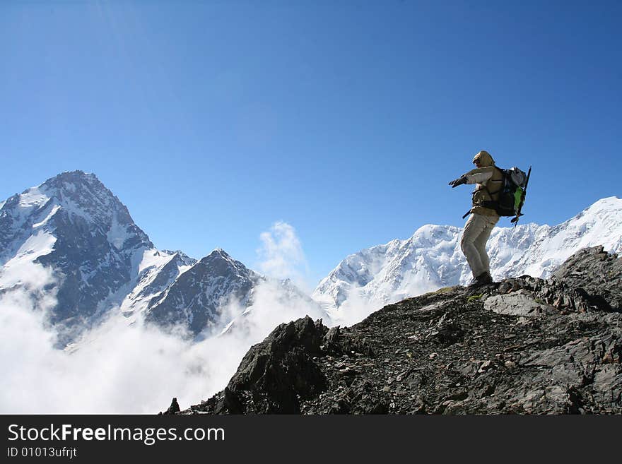 Hiker on the cliff in mountain, Backpacker