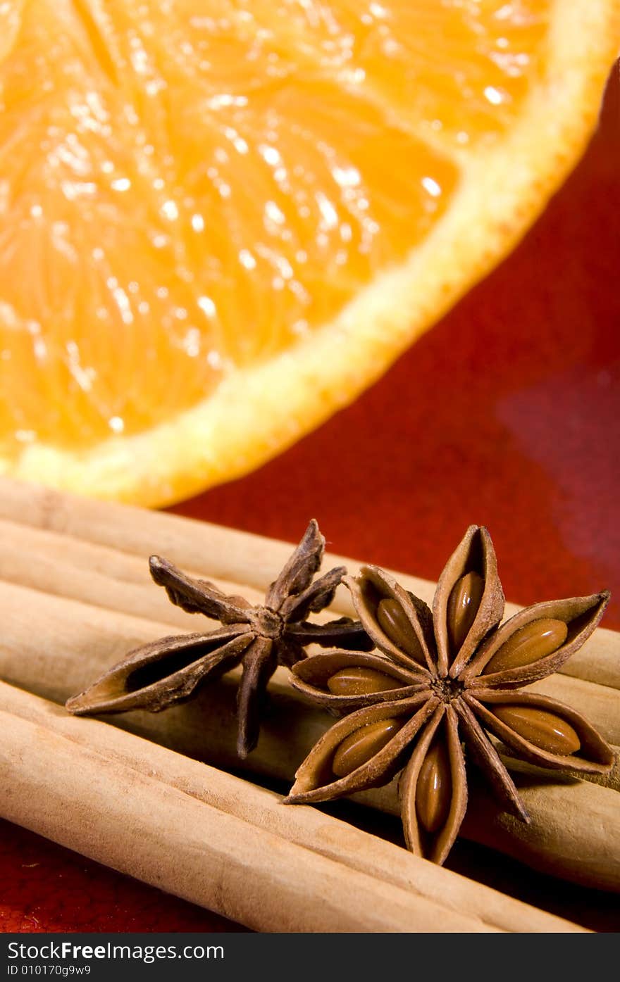 Cinnamon, anise and orange close up composition. Cinnamon, anise and orange close up composition