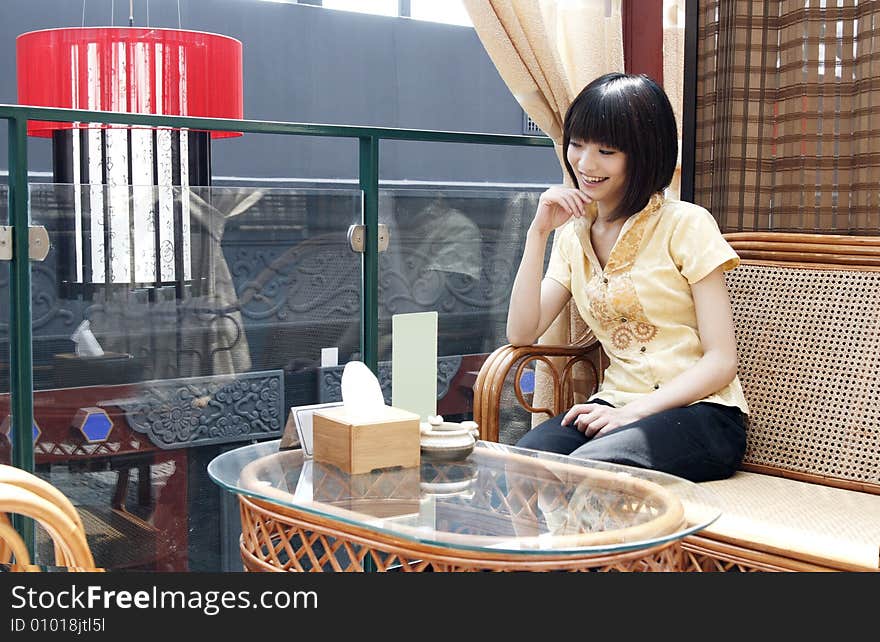 A girl in the ancient tea house of China. A girl in the ancient tea house of China.