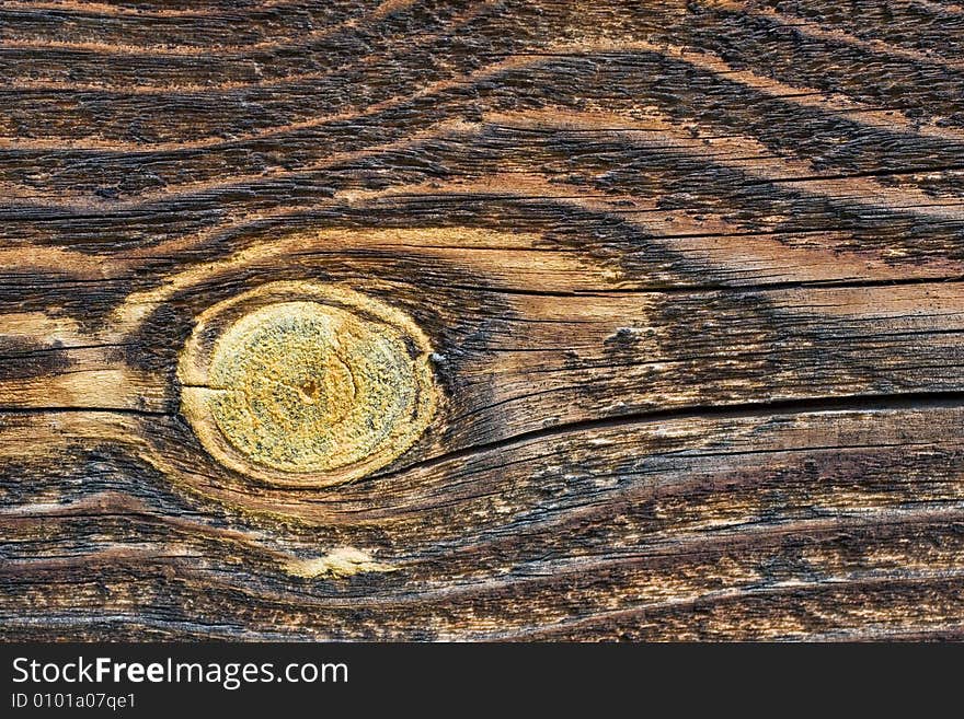 Texture of dark old wood with gnarl for backgrounds or texturing jobs. Texture of dark old wood with gnarl for backgrounds or texturing jobs