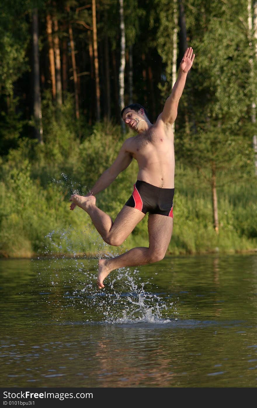 Happy jump in lake with smile. Happy jump in lake with smile