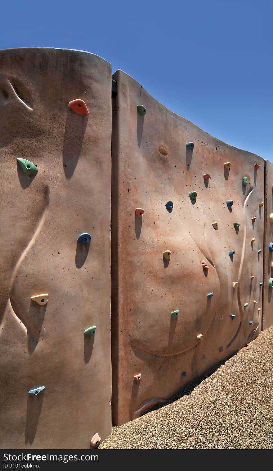 Climbing wall installation in play area of new community park in Gilbert, AZ