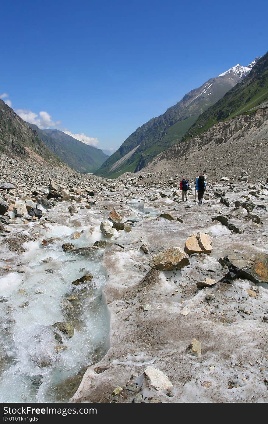 Hikers in mountains, Caucasus mountain, snow top, bezengi