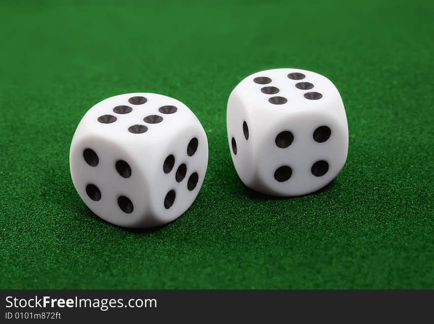 Two dices on green surface. Two six. Symbol of success