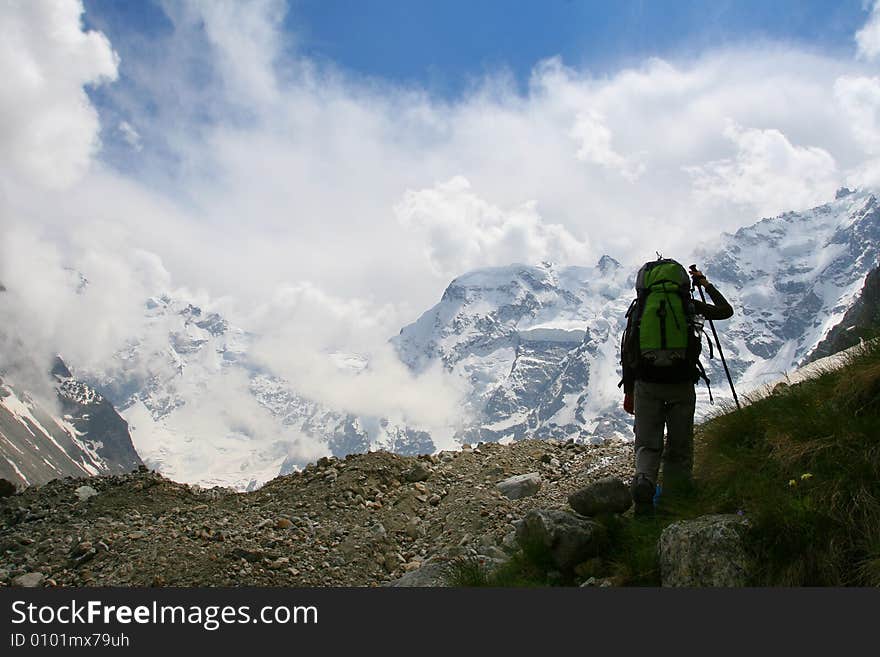 Backpackers silhouette, Hikers on the cliff in mountain