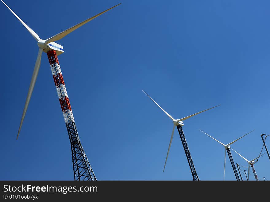 Windmills in blue sky