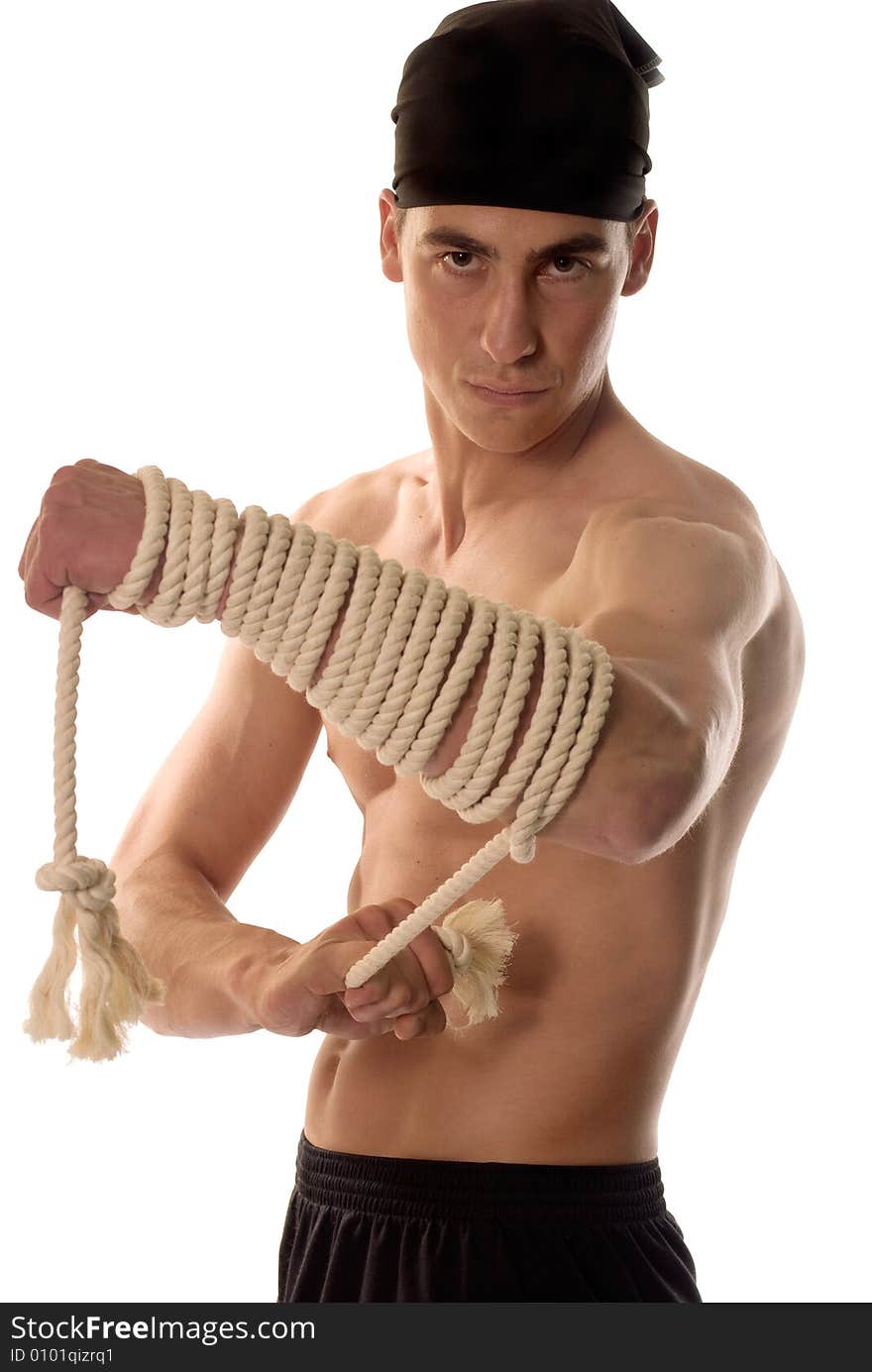 Muscular builder man with rope around hands. Muscular builder man with rope around hands