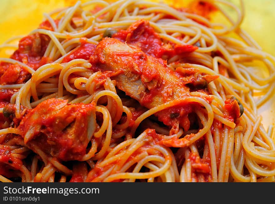 Dark Bran spaghetti pasta with tuna fish fillets sauce and tomato. Dark Bran spaghetti pasta with tuna fish fillets sauce and tomato.