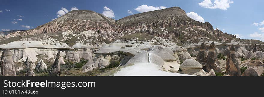 Panorama of mountain range in Cappadocia with unique rock formations. Panorama of mountain range in Cappadocia with unique rock formations