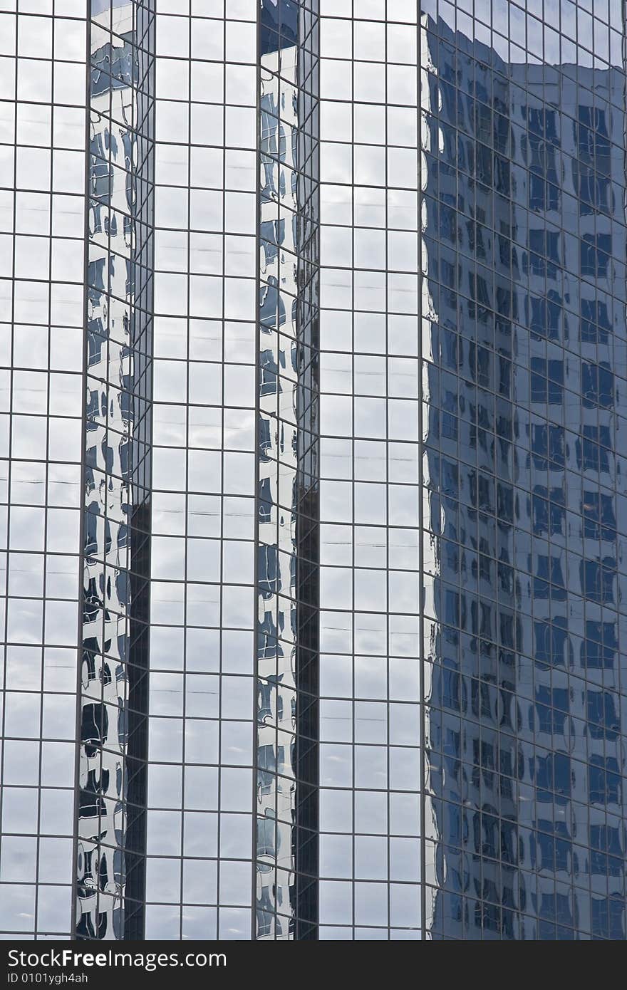 Modern glass office buildings with reflection in an urban area