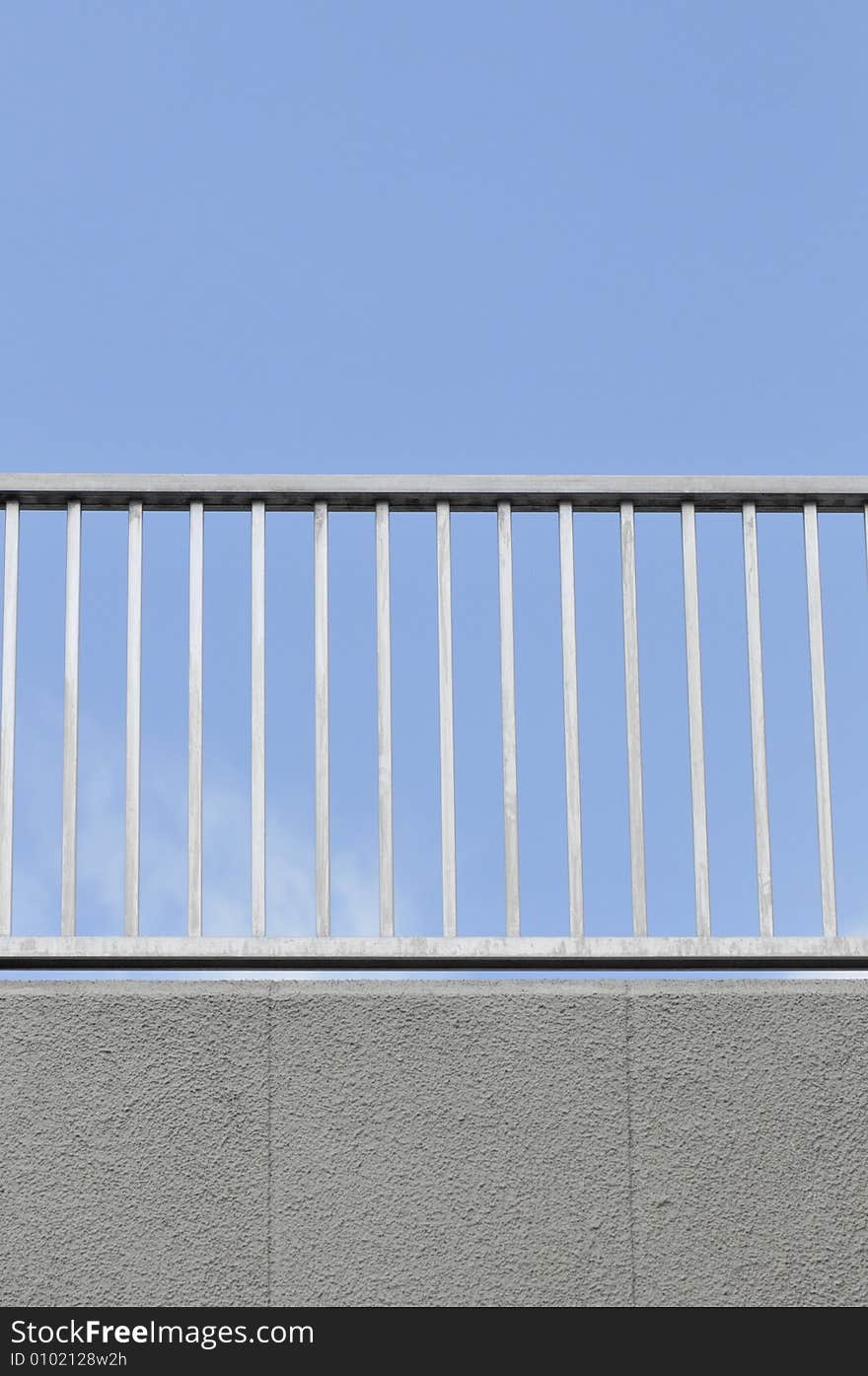 Simple railing against clear blue sky