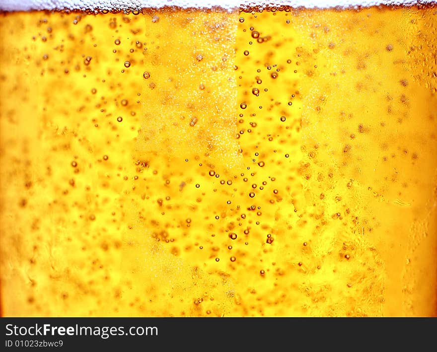 Glass of beer close-up with bubbles