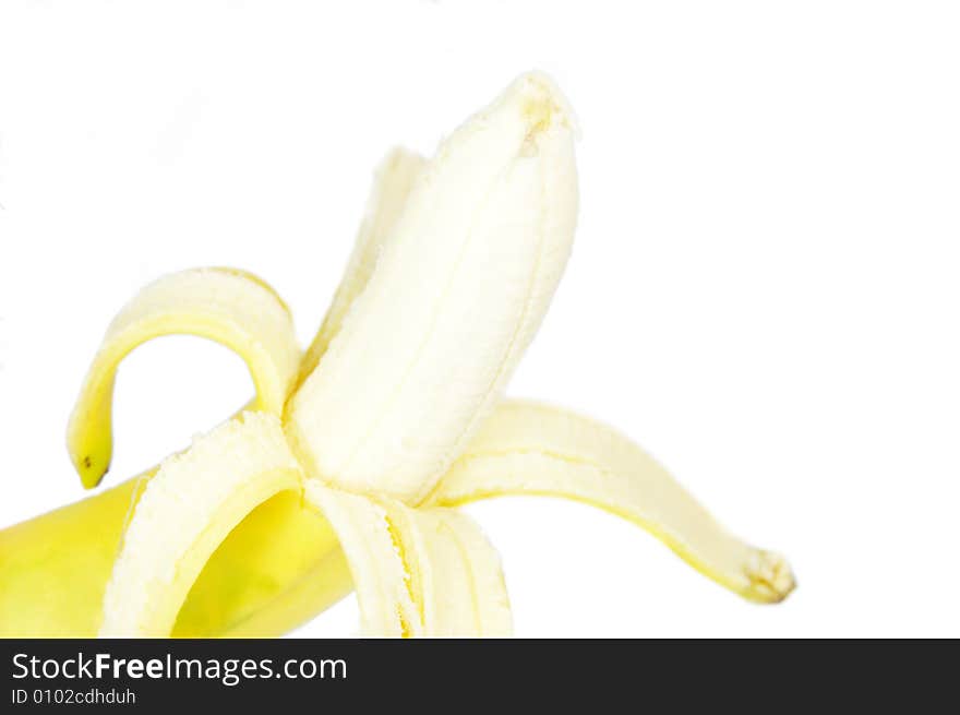 A single peeled fresh banana isolated on white background