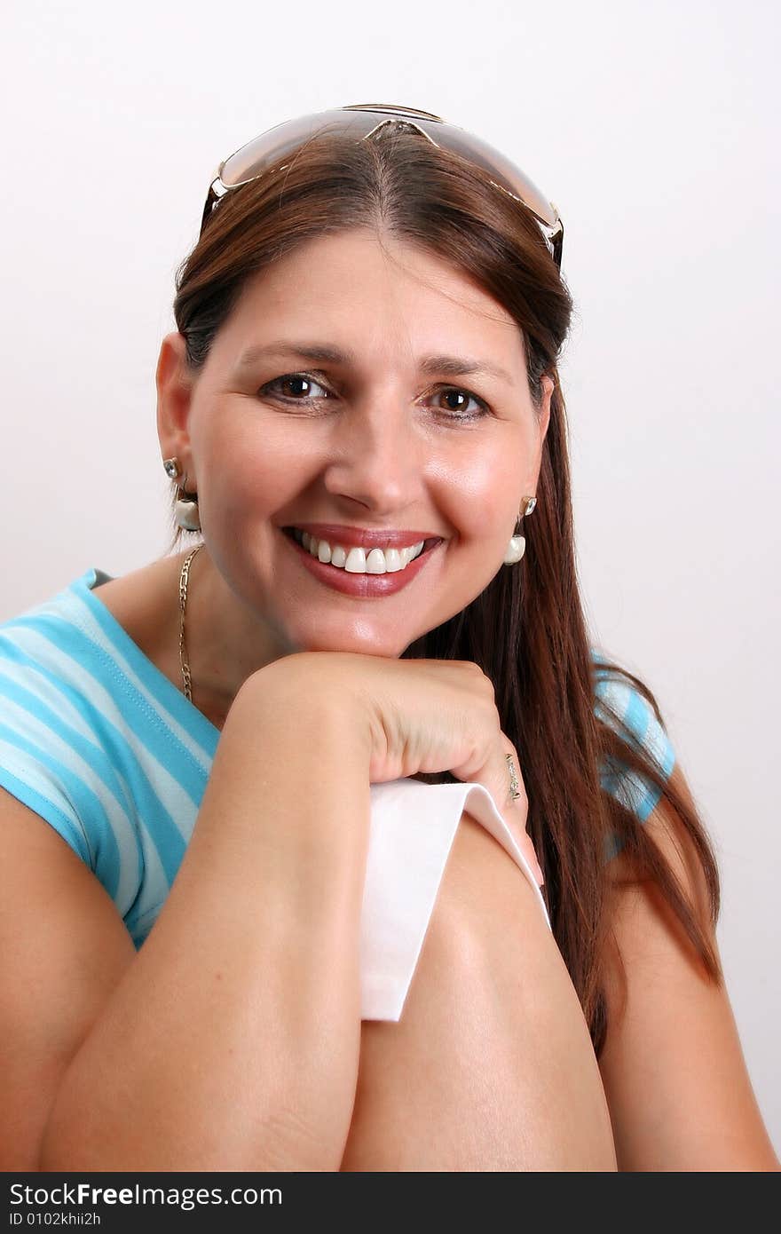 Adult Female Model wearing a blue striped top. Adult Female Model wearing a blue striped top