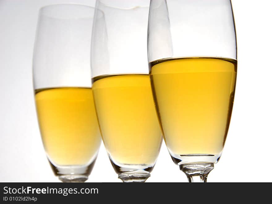 Three glasses of wine on white background