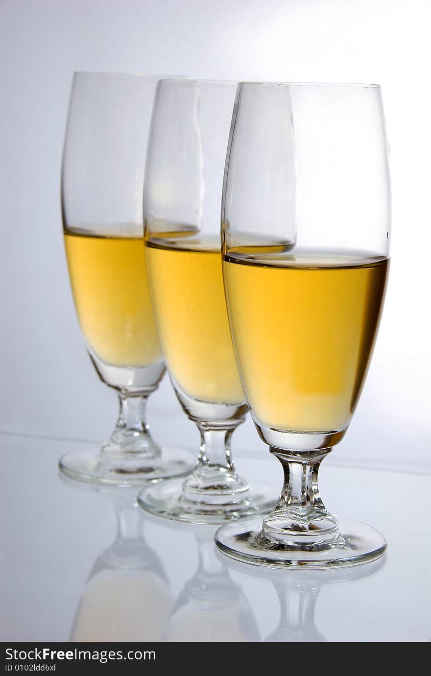 Three glasses of wine on white background