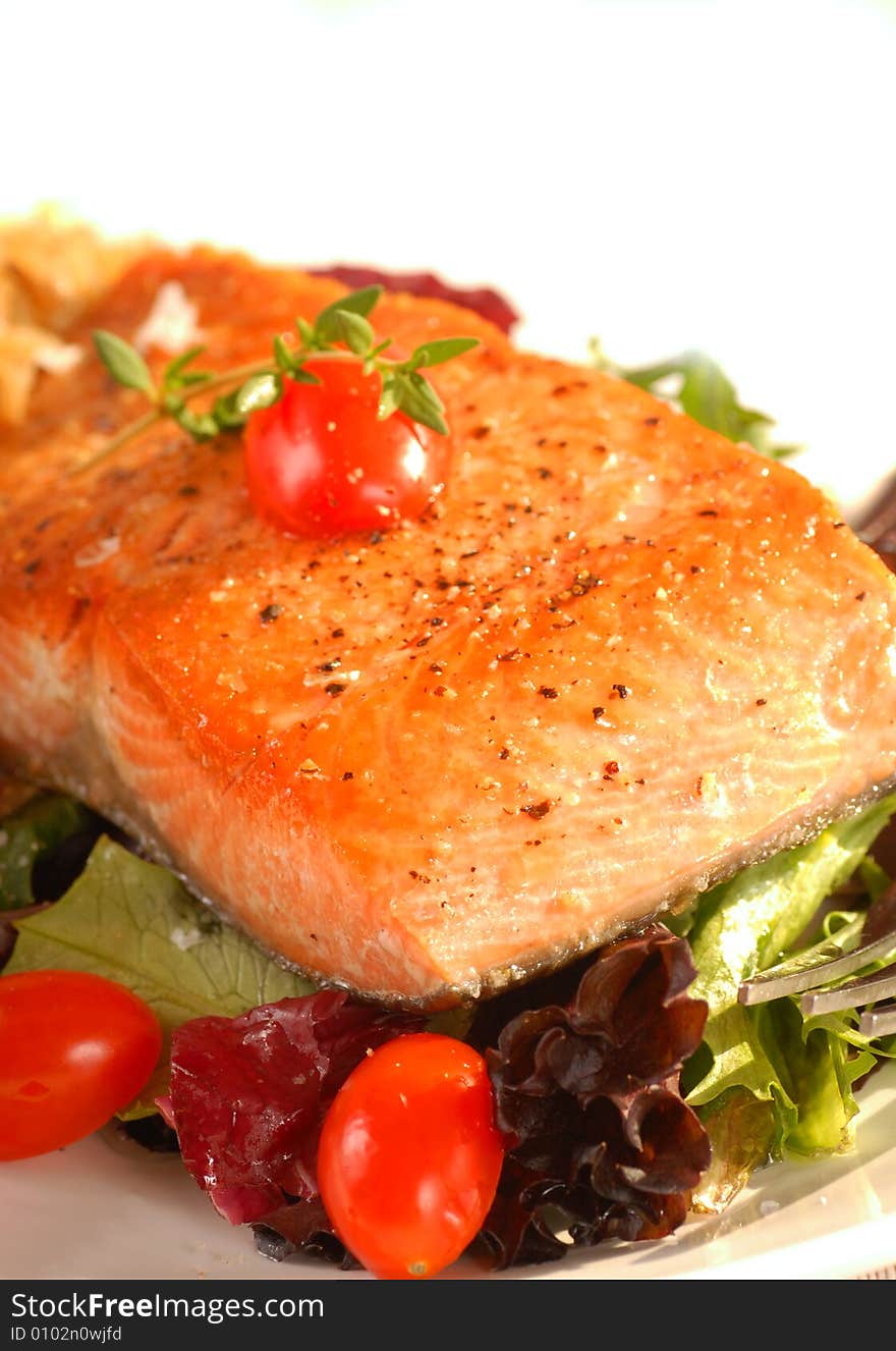 Seared Salmon On A Bed Of Greens With Tomato