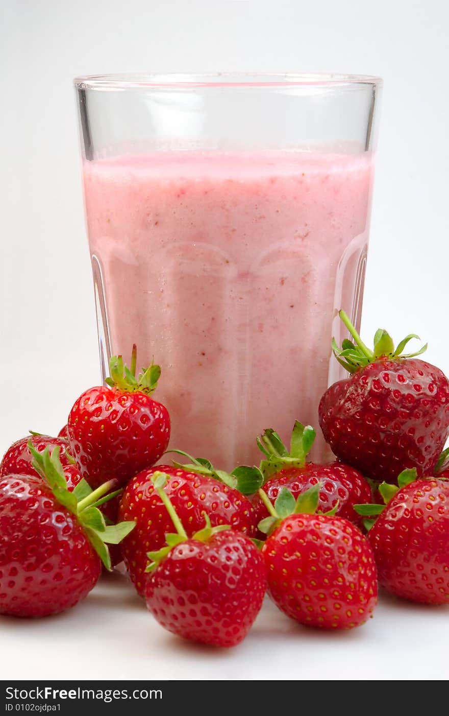 Milkshake in a glass with fresh strawberry. Milkshake in a glass with fresh strawberry.