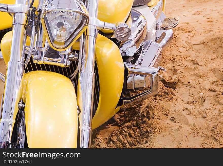 Yellow excellent motorbike on sand. Yellow excellent motorbike on sand