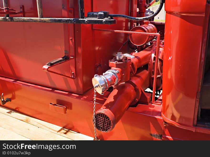 Close-up of discharge outlet and inlet pipe for water exchange on a 1937 Dodge fire engine. Close-up of discharge outlet and inlet pipe for water exchange on a 1937 Dodge fire engine.