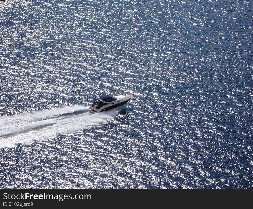 Motorboat at full speed on a splendid sea. Motorboat at full speed on a splendid sea