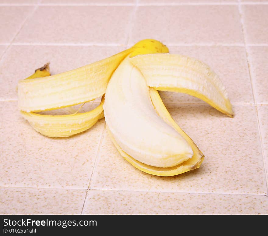 A banana on a kitchen counter top