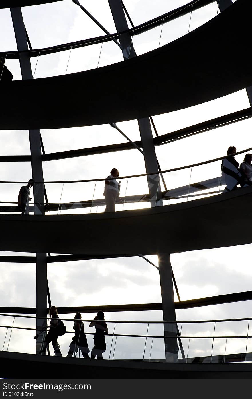 Reichstag inside, people are climbing up the starecase. Reichstag inside, people are climbing up the starecase