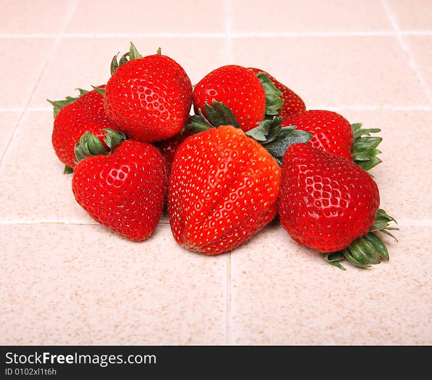 Strawberries on a kitchen counter top. Strawberries on a kitchen counter top