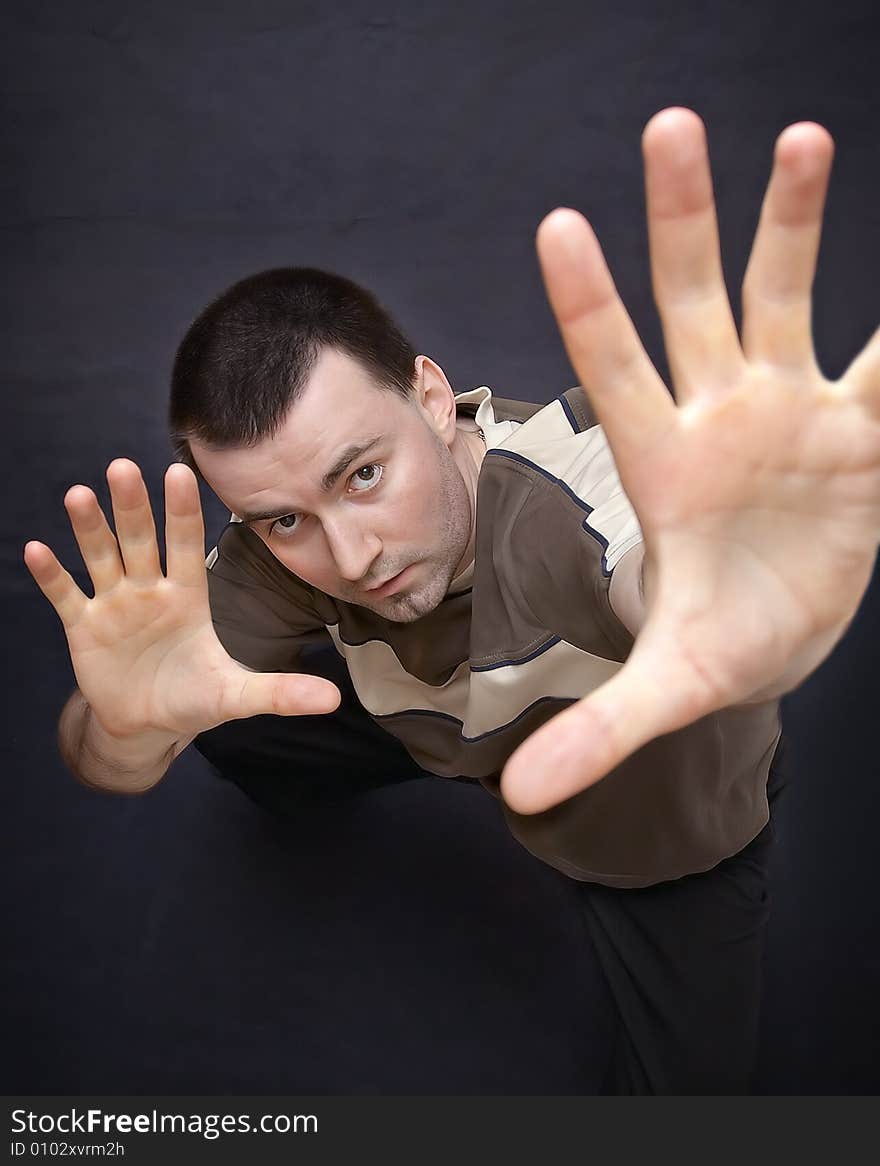 Young man closeup showing palms upwards. Young man closeup showing palms upwards