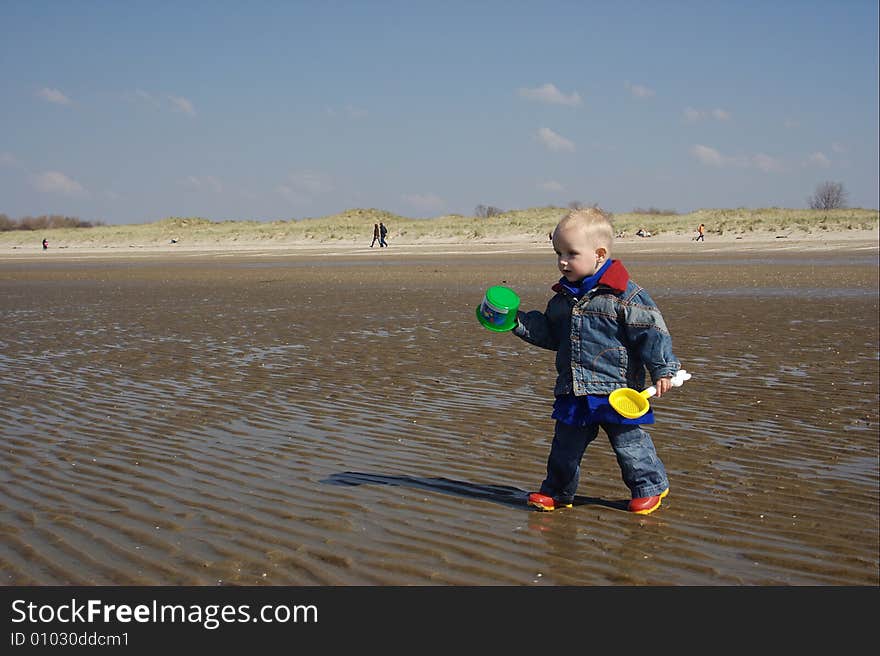 Little boy playingon the beach. Little boy playingon the beach